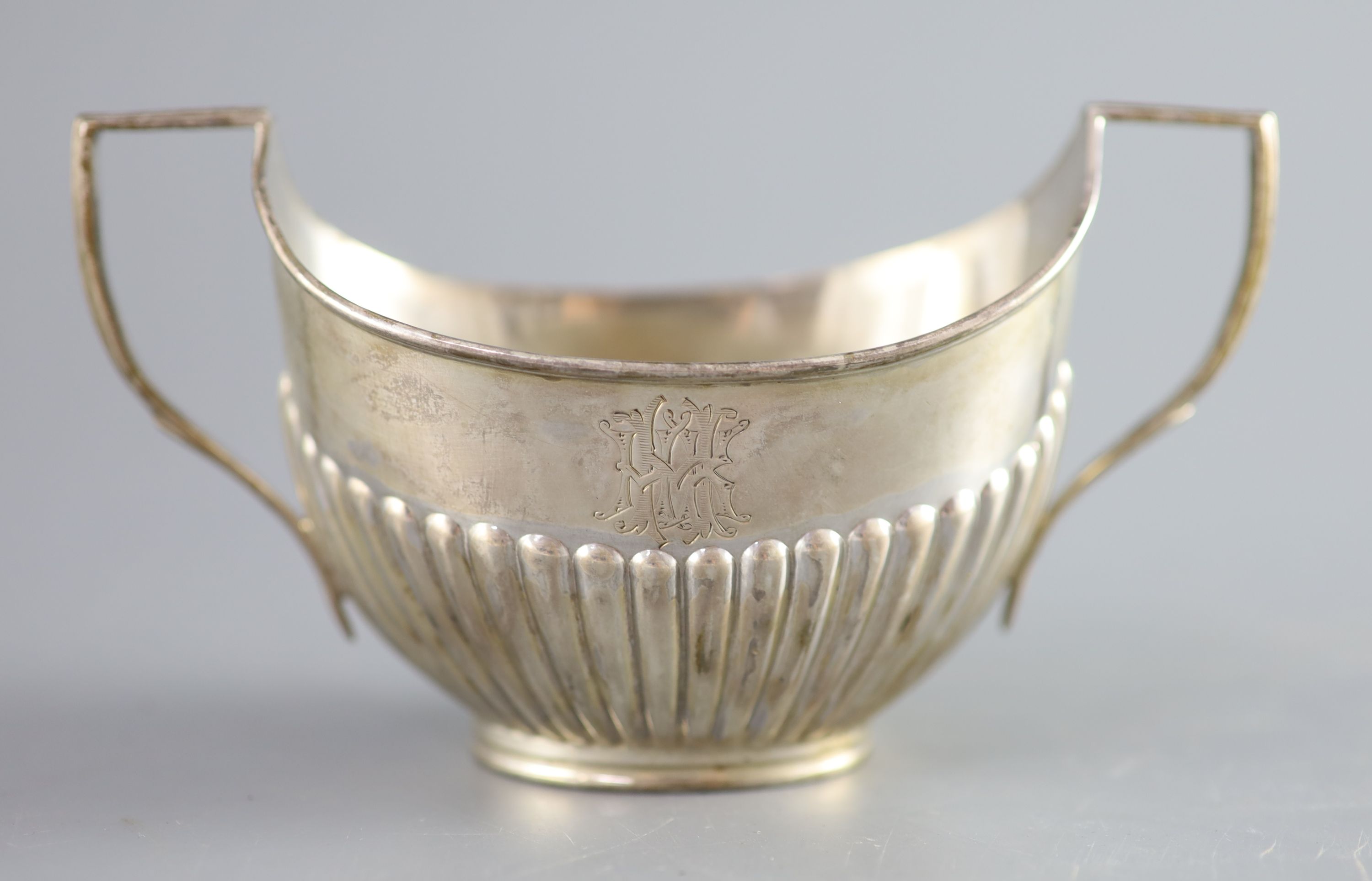A Victorian demi fluted silver two handled oval sugar bowl, width 15.2cm, 107 grams.